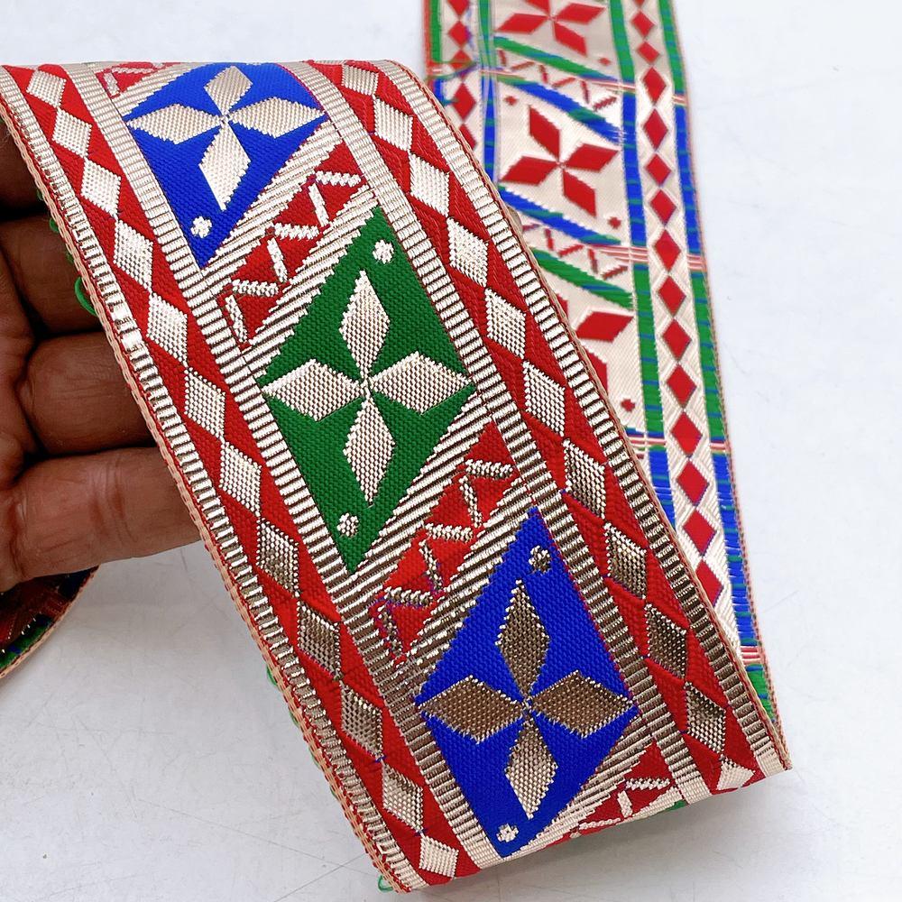 58mm Wide Colorful Geometric Floral Gota Work Jacquard Ribbon, shown on white cotton