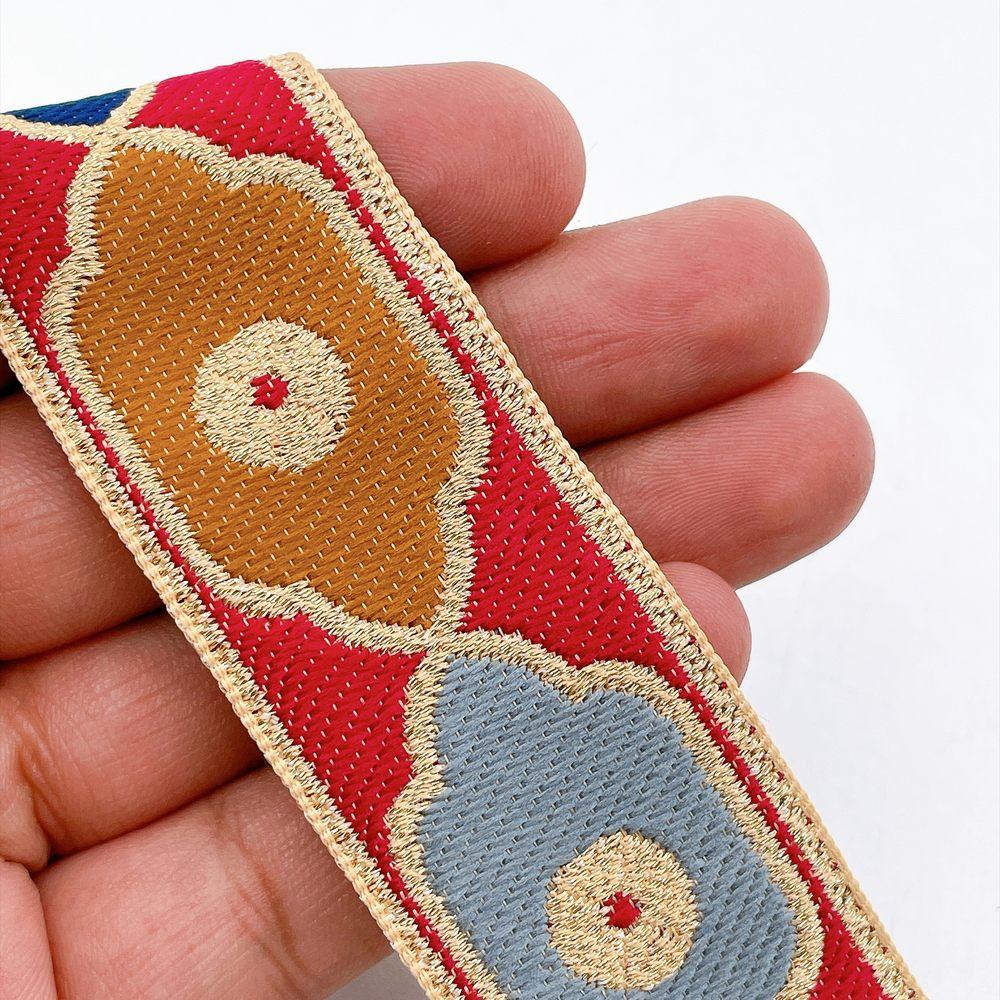 30mm Vintage Quatrefoil Pattern Jacquard Ribbon for Sewing and Crafts, shown on white cotton