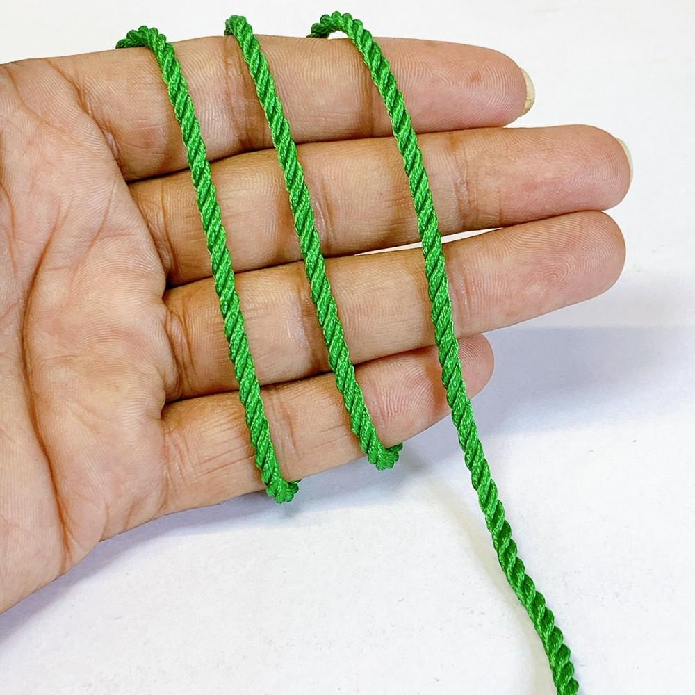 3mm Shiny Twisted Dori Cord - Multicolor Decorative Rope Trim for Apparel, Jewelry, and Macrame, shown on white cotton