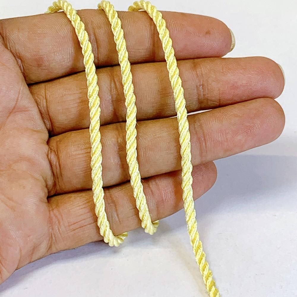3mm Shiny Twisted Dori Cord - Multicolor Decorative Rope Trim for Apparel, Jewelry, and Macrame, shown on white cotton
