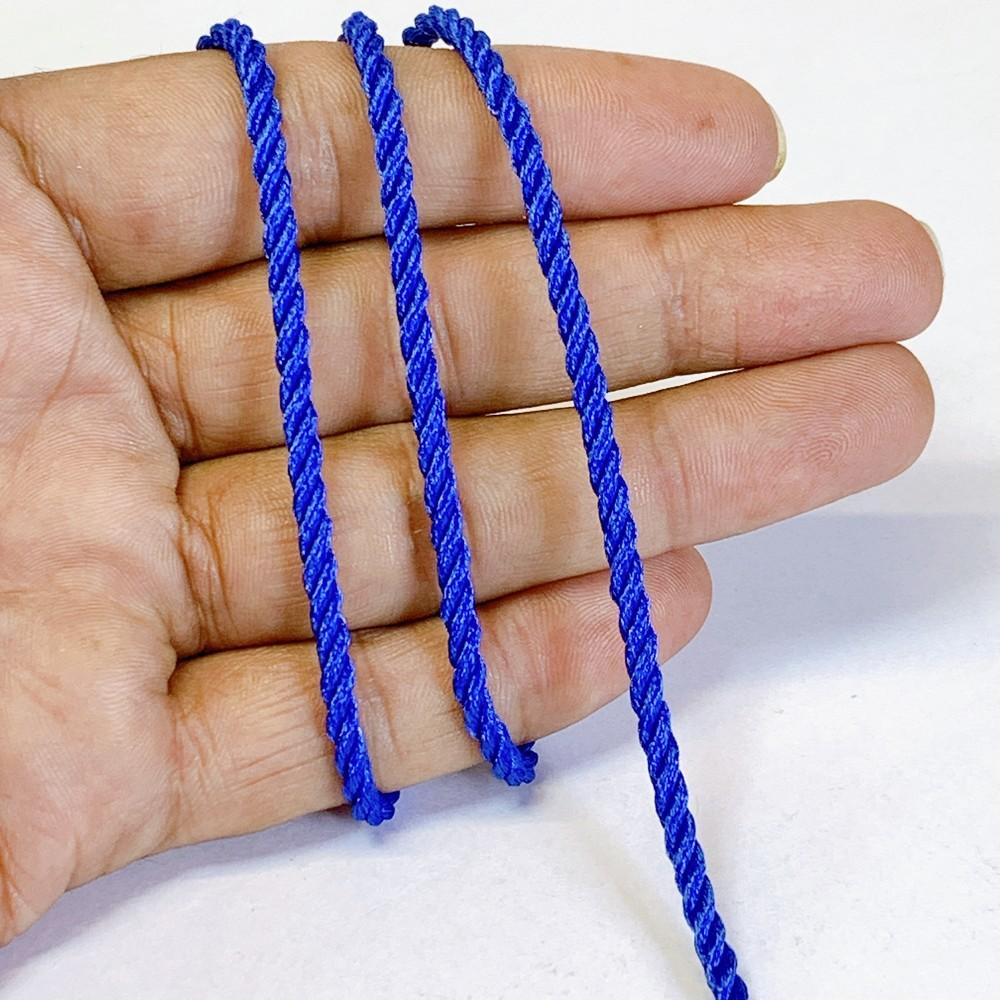 3mm Shiny Twisted Dori Cord - Multicolor Decorative Rope Trim for Apparel, Jewelry, and Macrame, shown on white cotton
