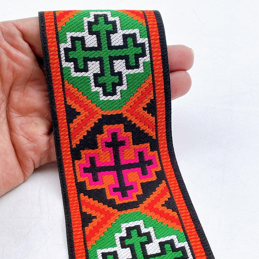 65mm Wide Tribal Jacquard Ribbon Trim - Colorful Geometric Tapestry Border for Bag Straps and Apparel, shown on white cotton