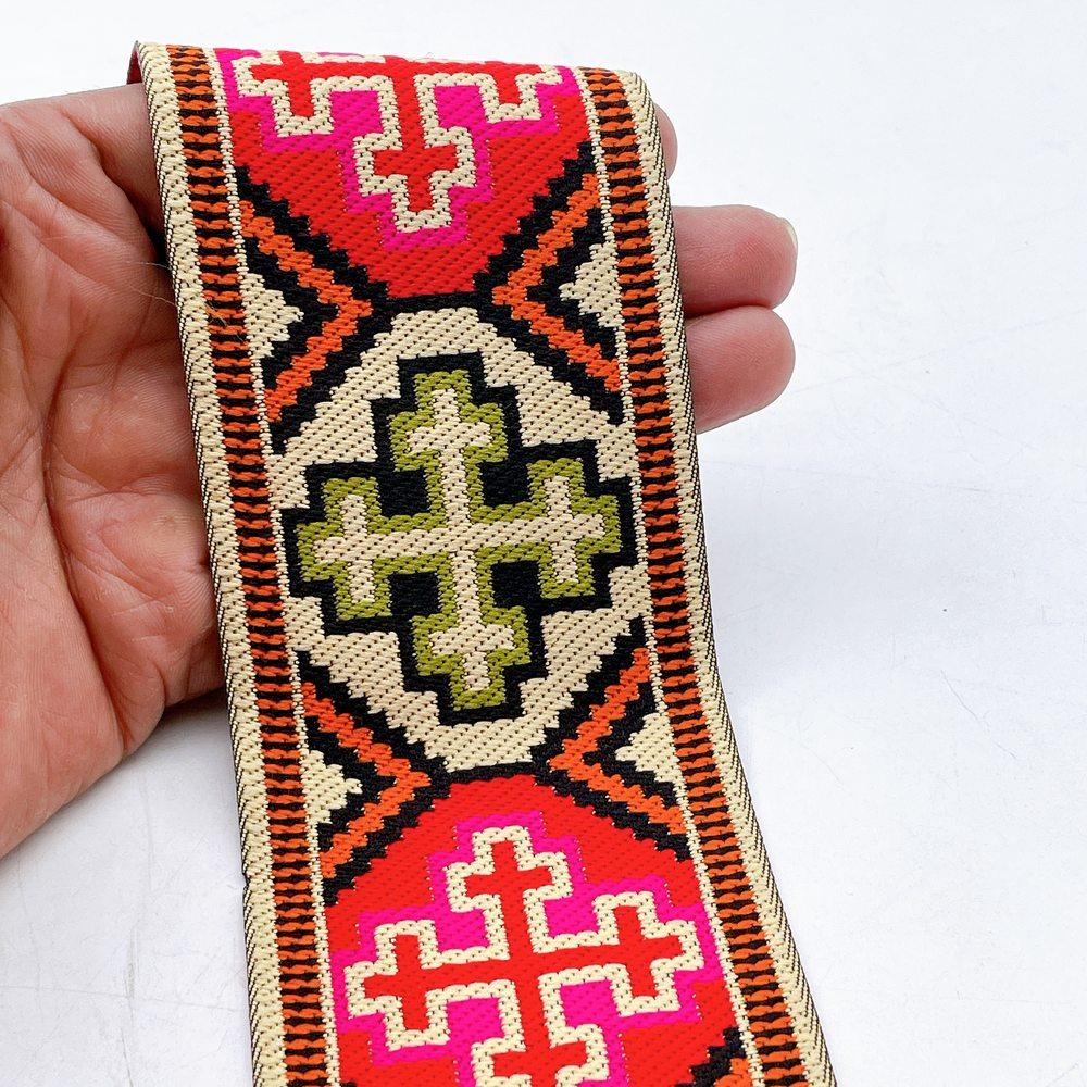 65mm Wide Tribal Jacquard Ribbon Trim - Colorful Geometric Tapestry Border for Bag Straps and Apparel, shown on white cotton