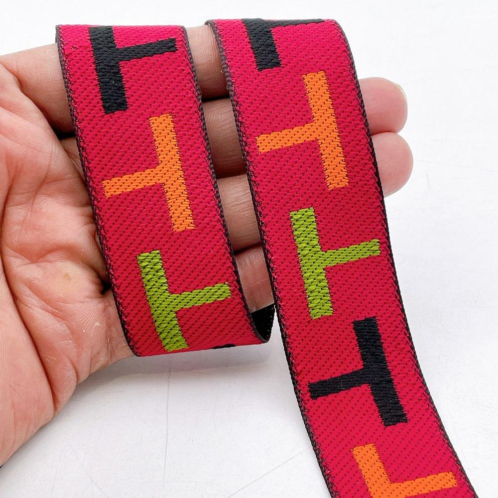 28mm Sporty Geometric Jacquard Ribbon Trim - Woven 'T' Pattern Tape for Apparel and Bag Straps, shown on white cotton