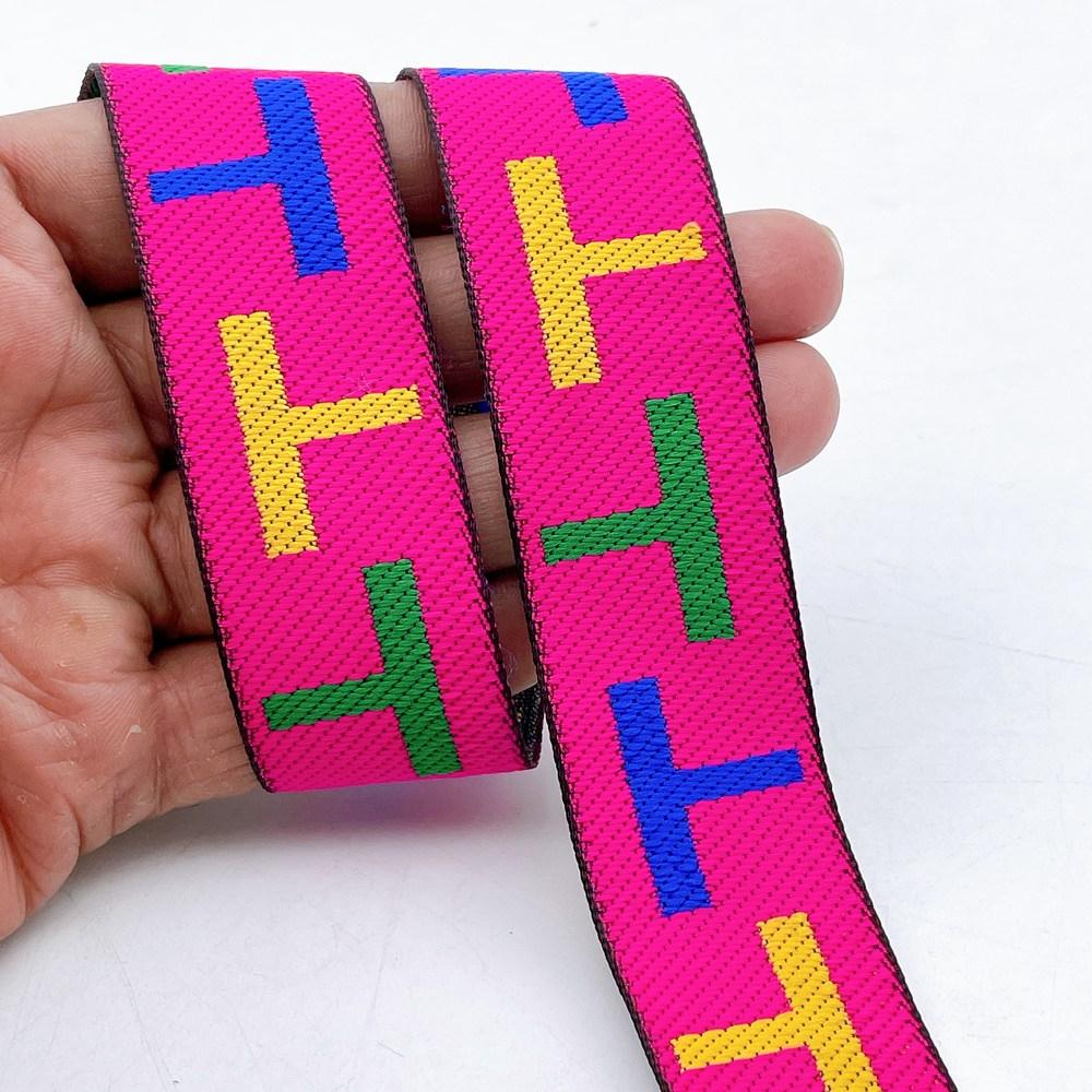 28mm Sporty Geometric Jacquard Ribbon Trim - Woven 'T' Pattern Tape for Apparel and Bag Straps, shown on white cotton