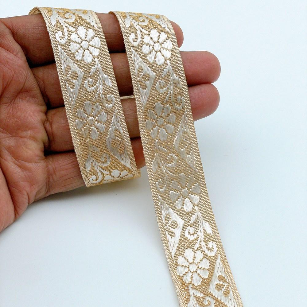 22mm Ready-to-Dye Floral Motif Lace Tape - Woven Trim for Sarees, Apparel, and Crafts, shown on white cotton