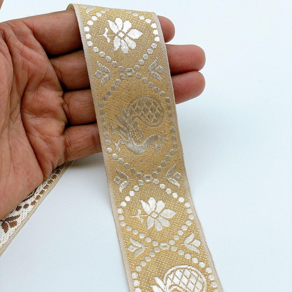 40mm Ready-to-Dye Traditional Bird Lace Tape - Woven Trim for Sarees and Apparel, shown on white cotton