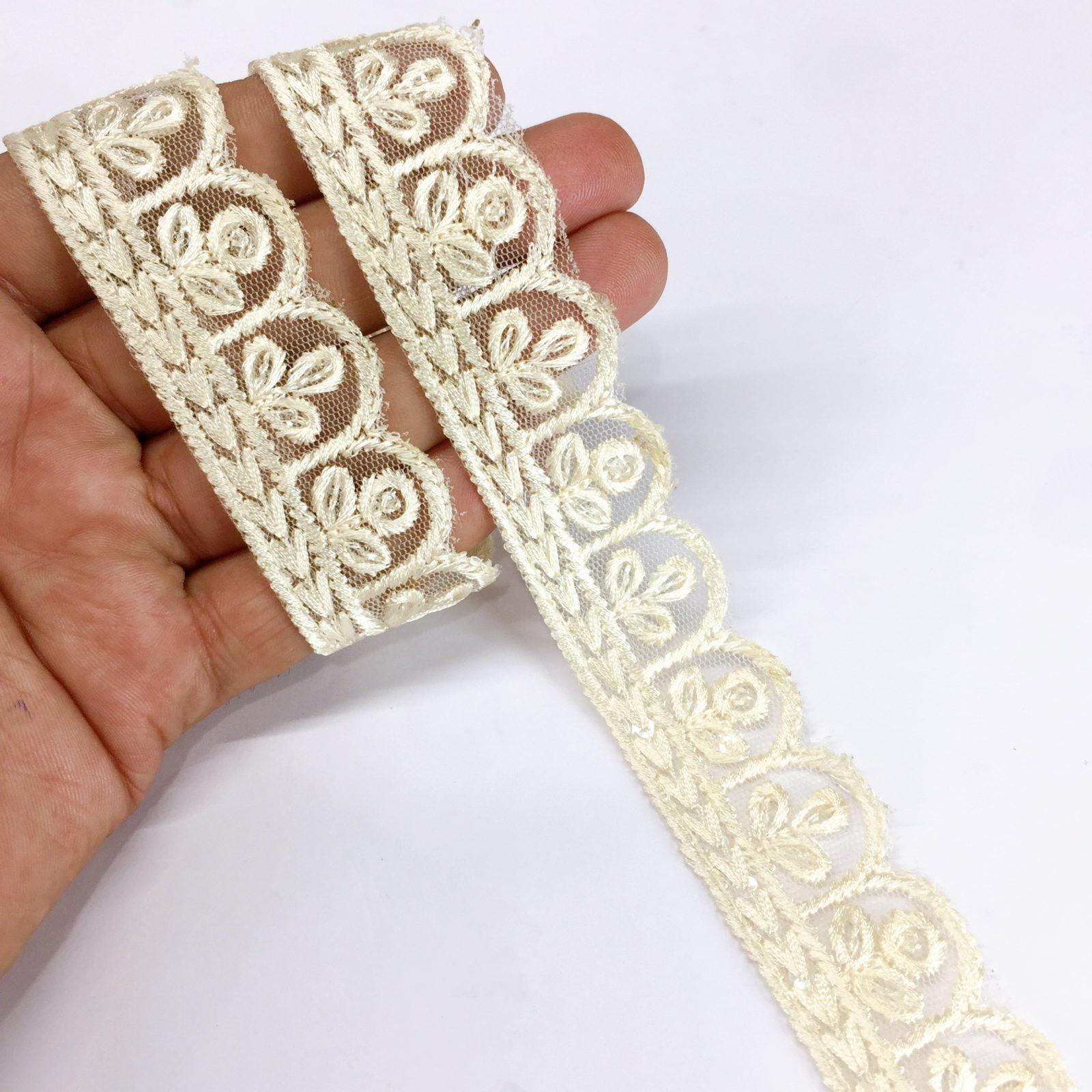 25mm Jute Flower Design Embroidery Cutwork lace with Matching Sequins Work Border, shown on white cotton