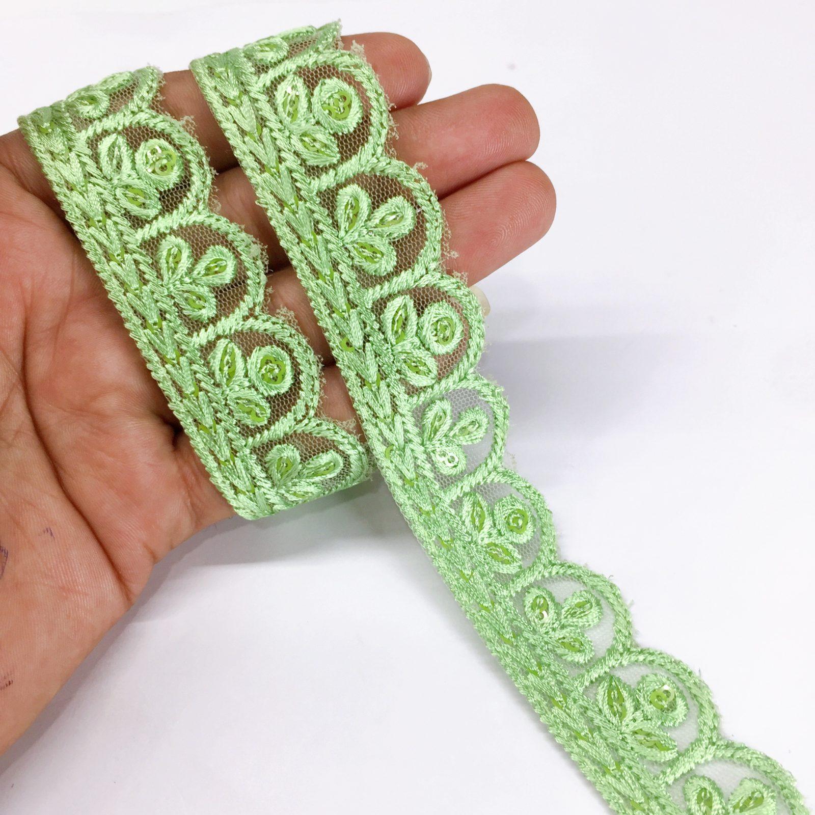 25mm Jute Flower Design Embroidery Cutwork lace with Matching Sequins Work Border, shown on white cotton