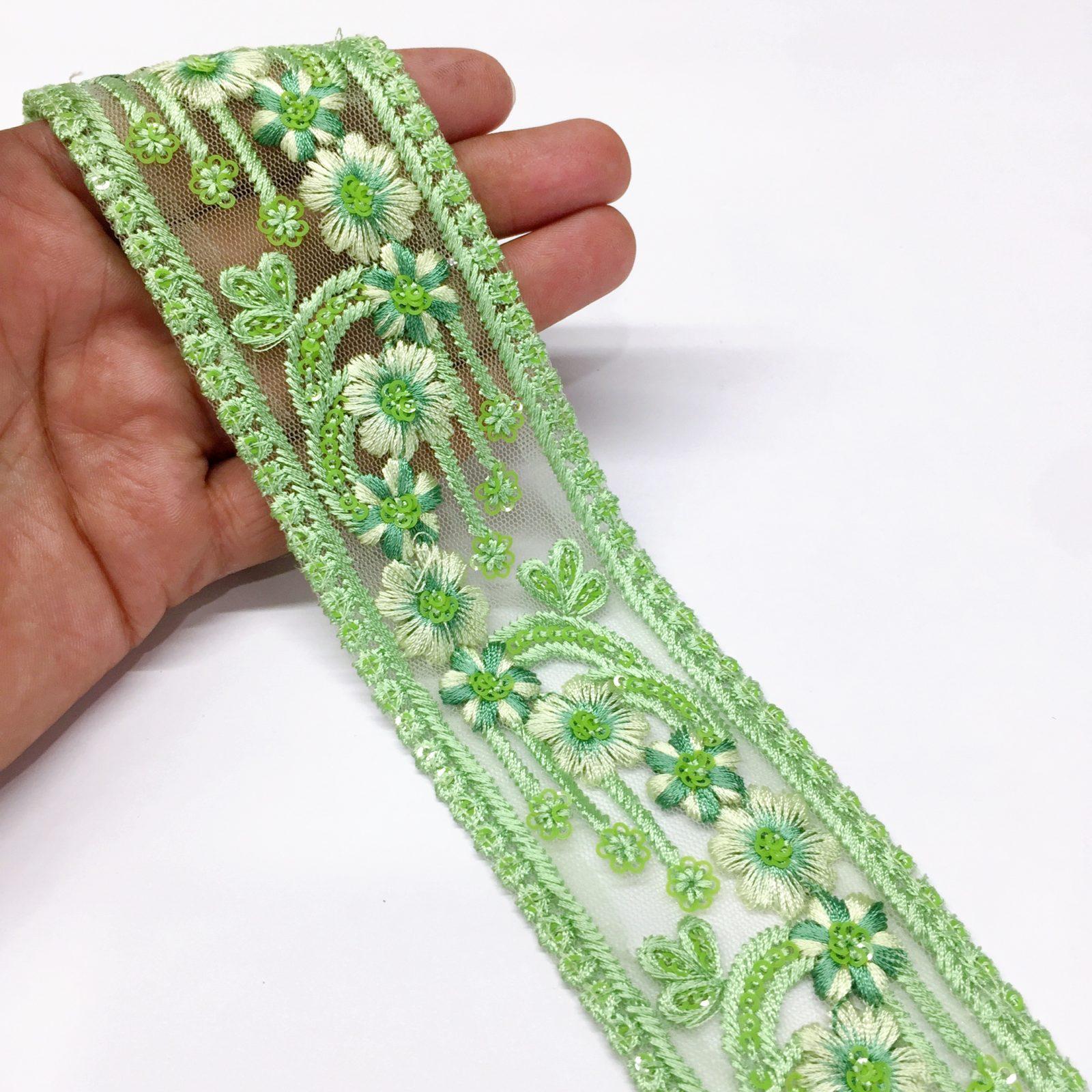50mm Flower Design Embroidery lace with Sequins Work, shown on white cotton