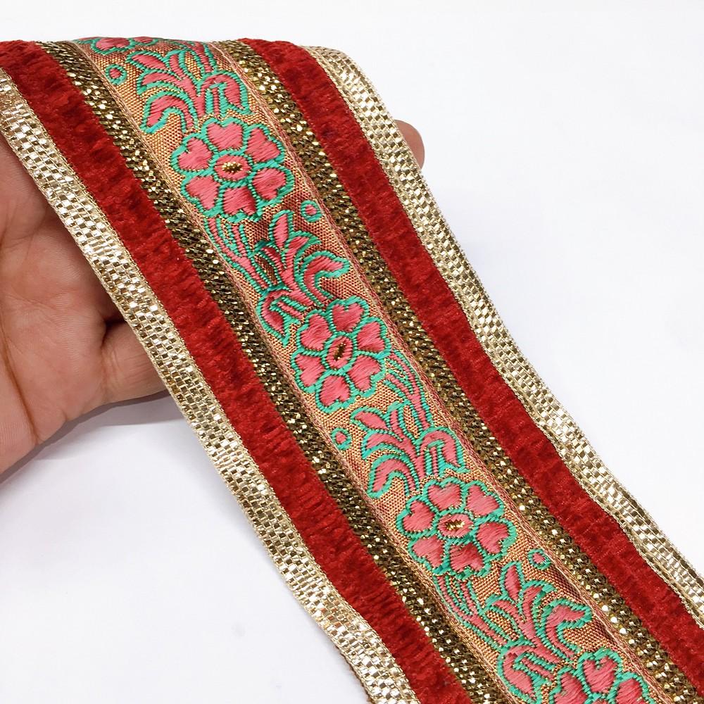 80mm tomato flower design with velvet and sequin, shown on white cotton