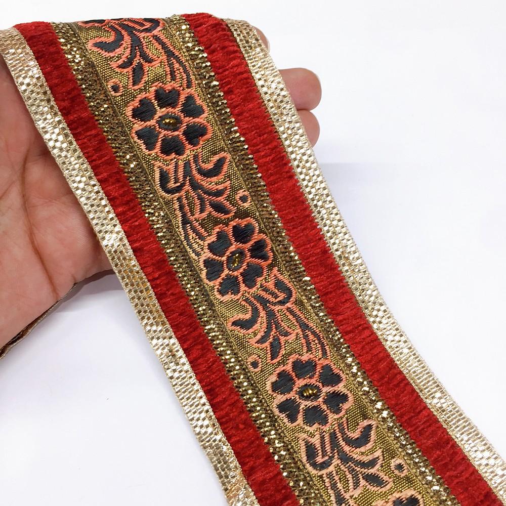 80mm tomato flower design with velvet and sequin, shown on white cotton