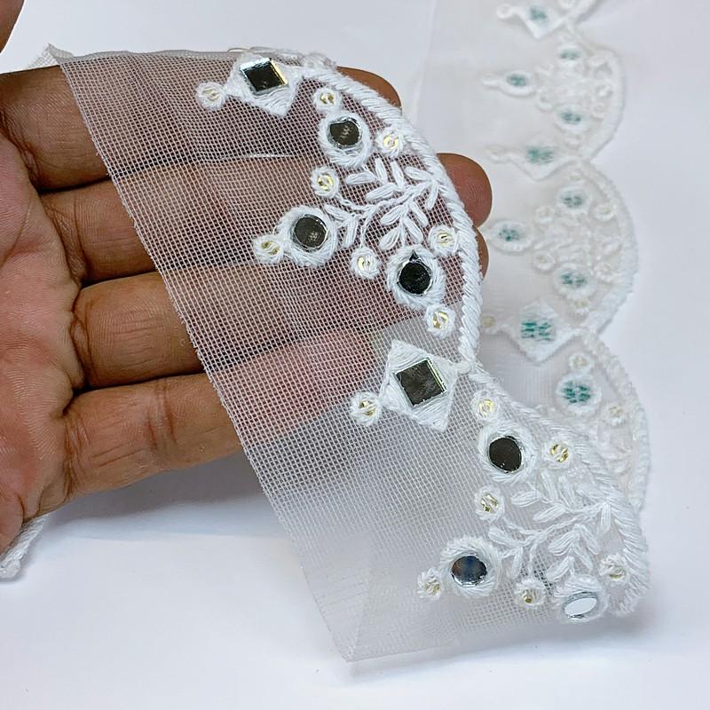 50mm Cotton Embroidery With Sequins and Mirror, shown on white cotton