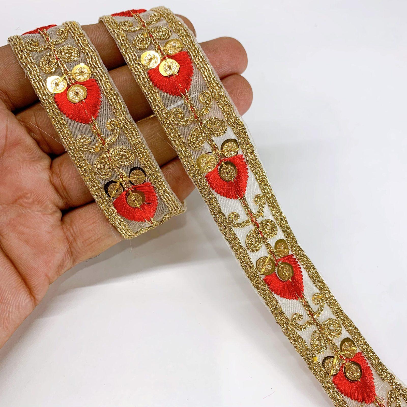 20mm Leaf Design Embroidery lace with Golden Sequins and Dori Work Border, shown on white cotton