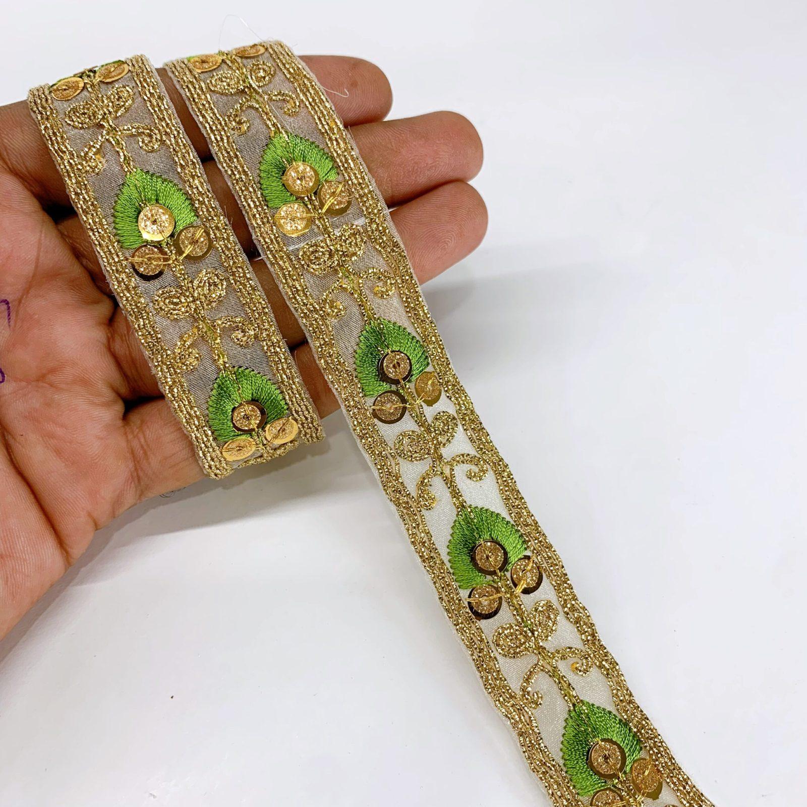 20mm Leaf Design Embroidery lace with Golden Sequins and Dori Work Border, shown on white cotton