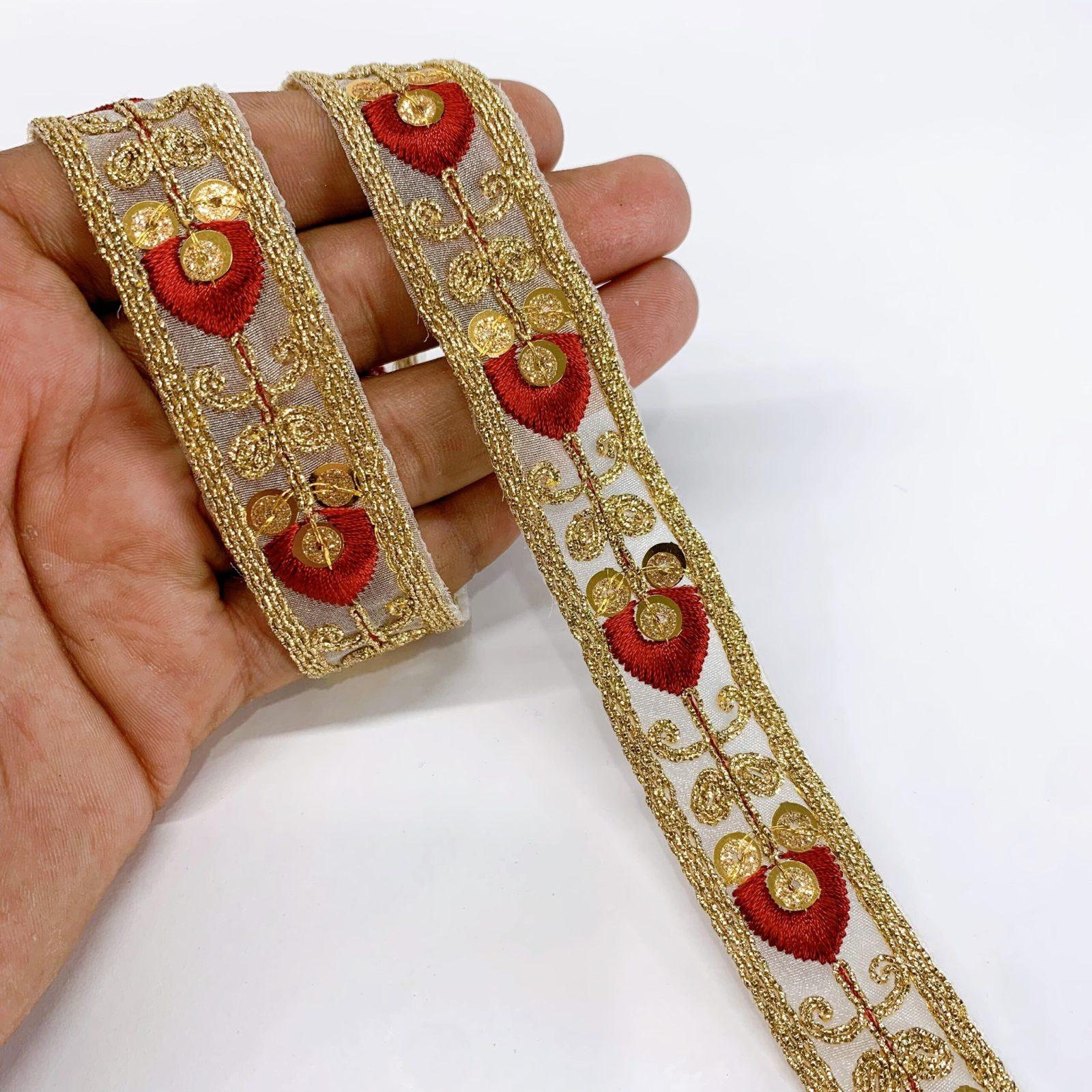 20mm Leaf Design Embroidery lace with Golden Sequins and Dori Work Border, shown on white cotton
