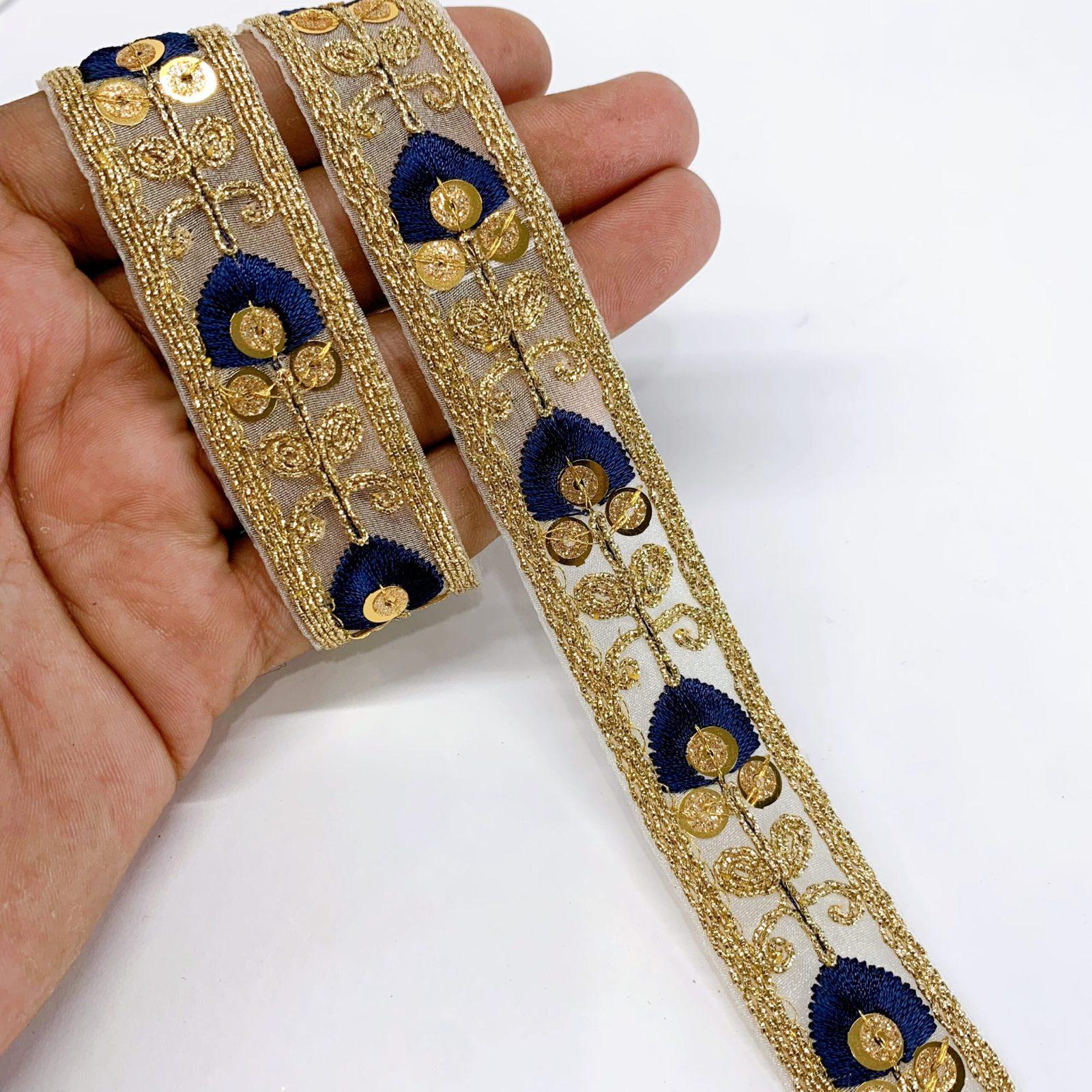 20mm Leaf Design Embroidery lace with Golden Sequins and Dori Work Border, shown on white cotton