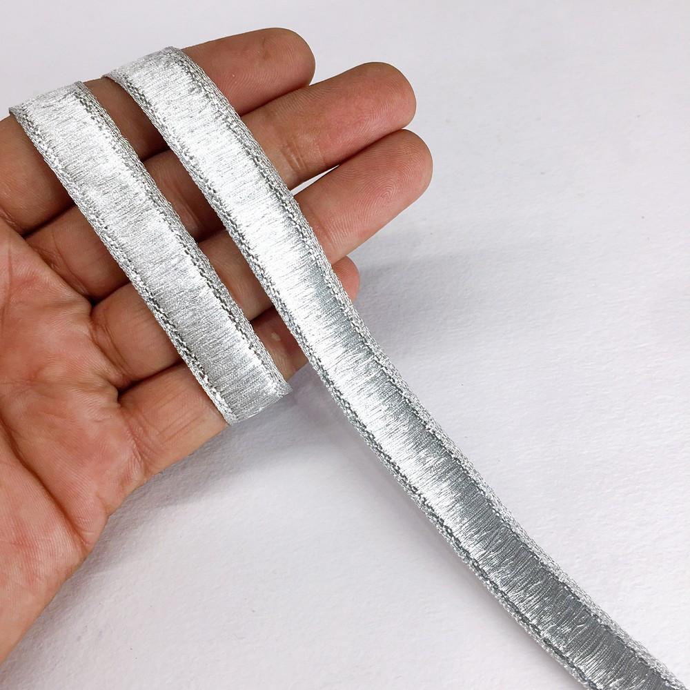 13 mm Thick Gold Metallic Zari Ribbon, shown on white cotton