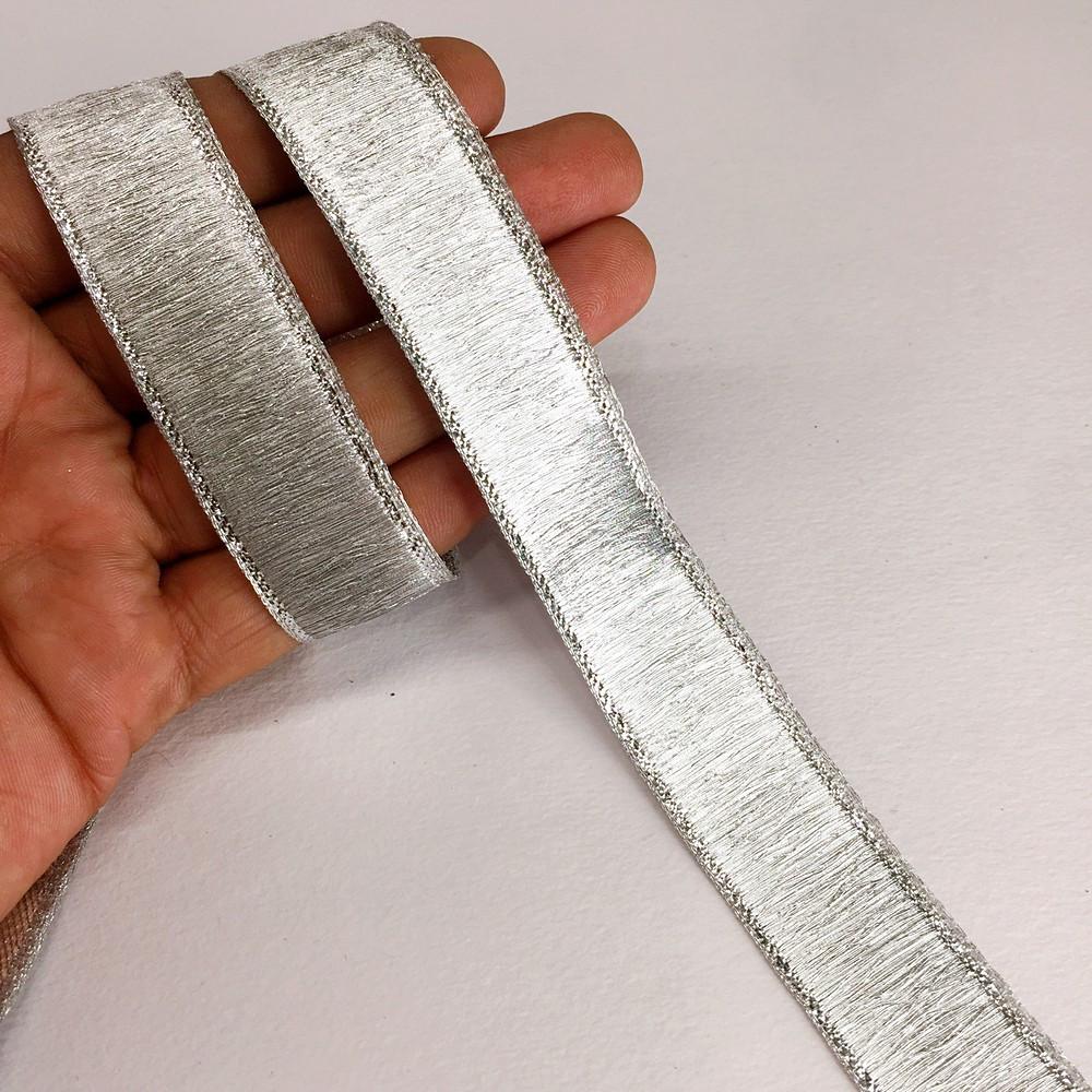 24 mm Thick Gold Metallic Zari Ribbon, shown on white cotton