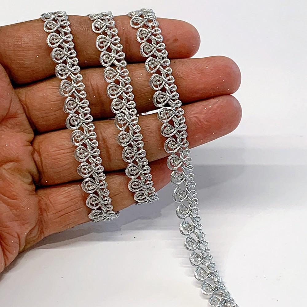9 mm Knitted Decorative Ribbon, shown on white cotton