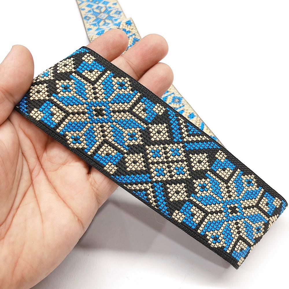 56 mm Geometric Flower Jacquard Ribbon, shown on white cotton