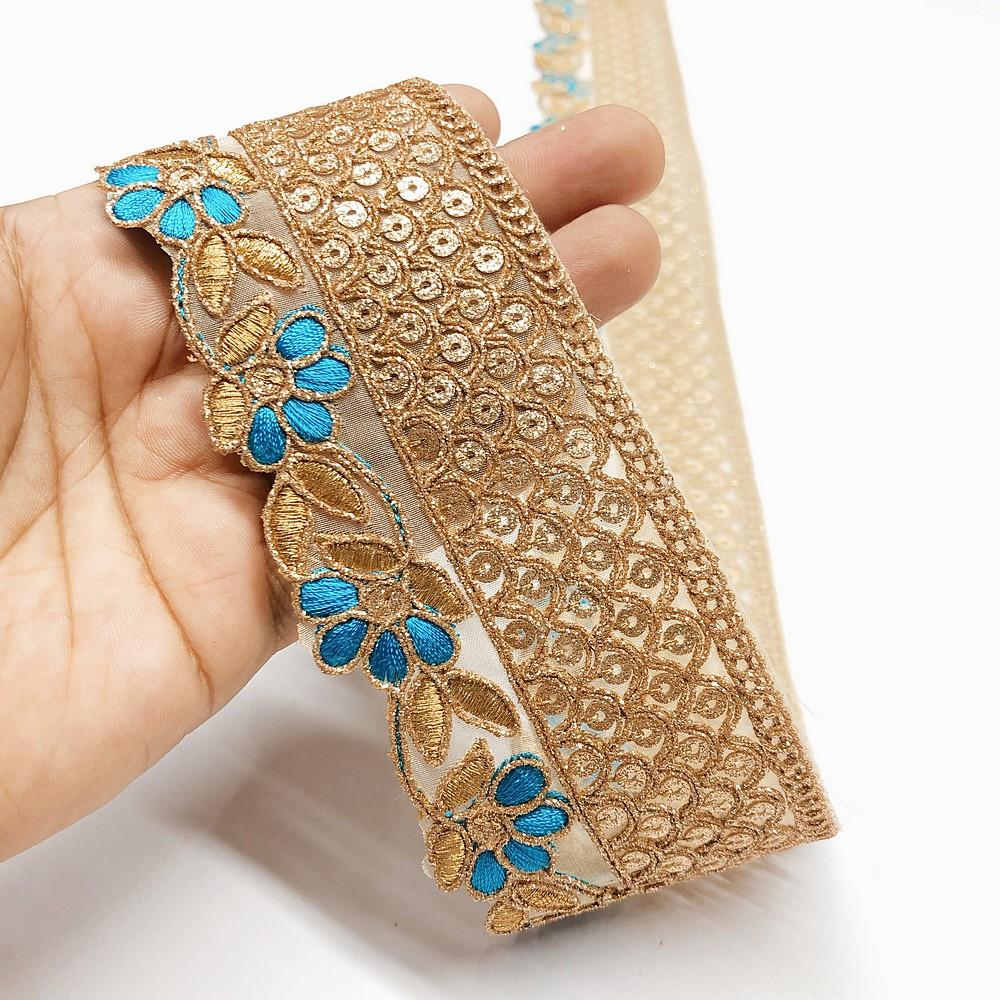 60mm Flower Design Cutwork Embroidery Lace With Sequins And Dori Work, shown on white cotton