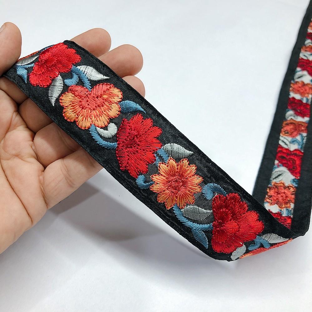 30mm Flower Design Parsi Embroidery Lace, shown on white cotton