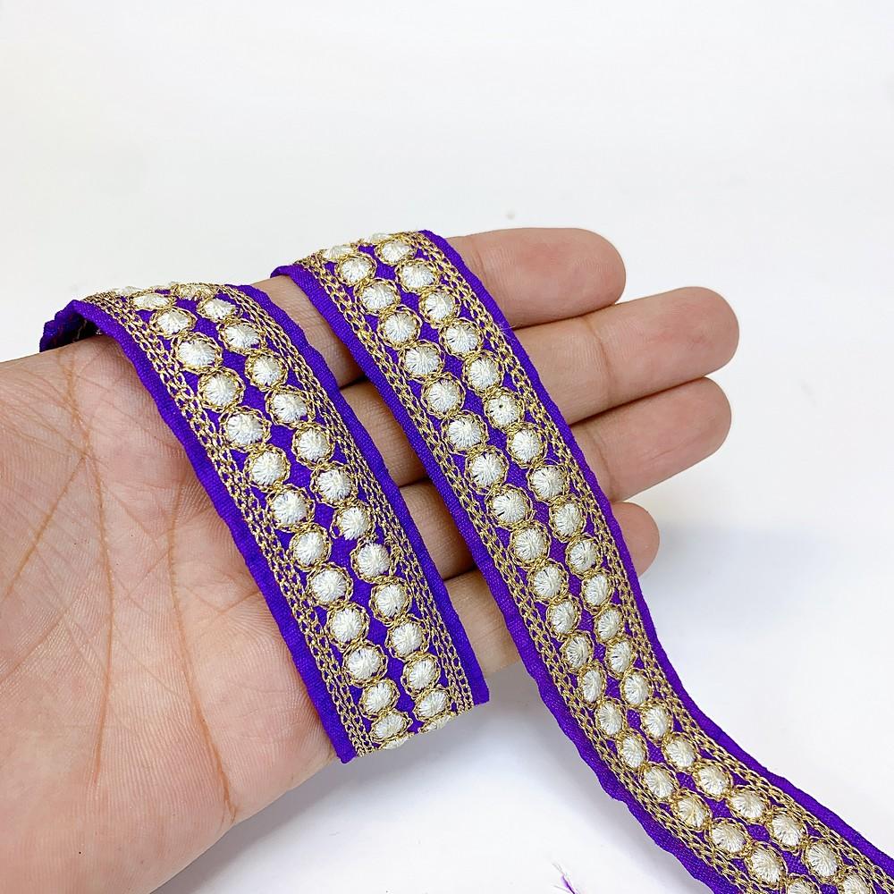 25mm Dot Design Embroidery Lace, shown on white cotton