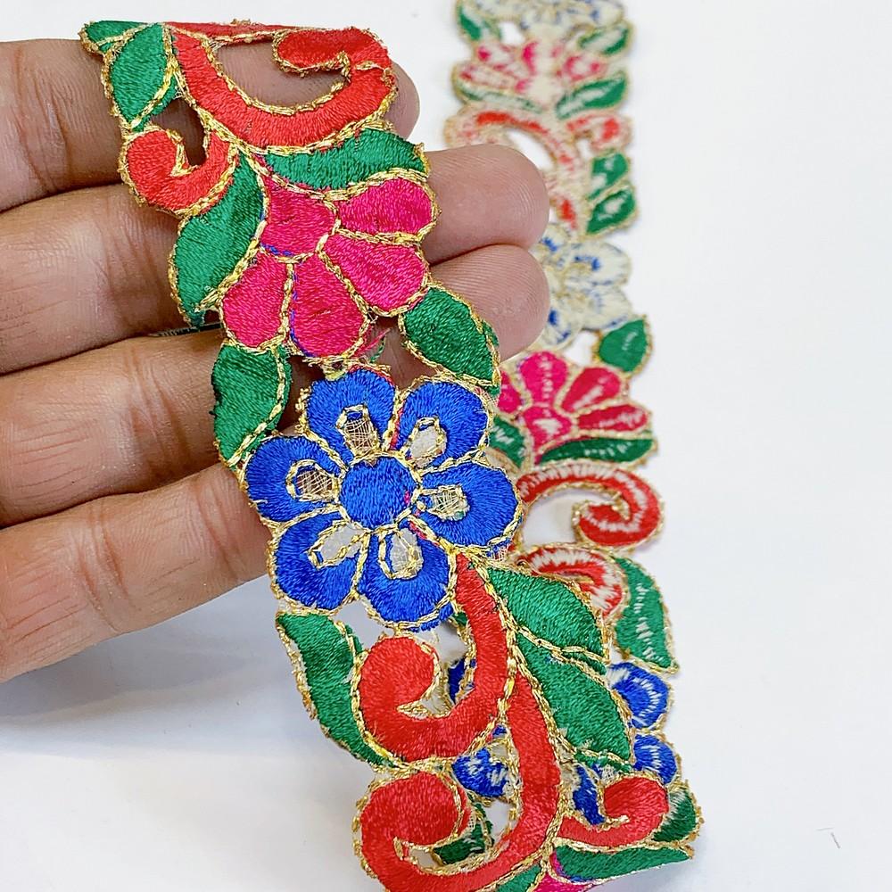 25mm Designer Cutwork Embroidery Lace, shown on white cotton