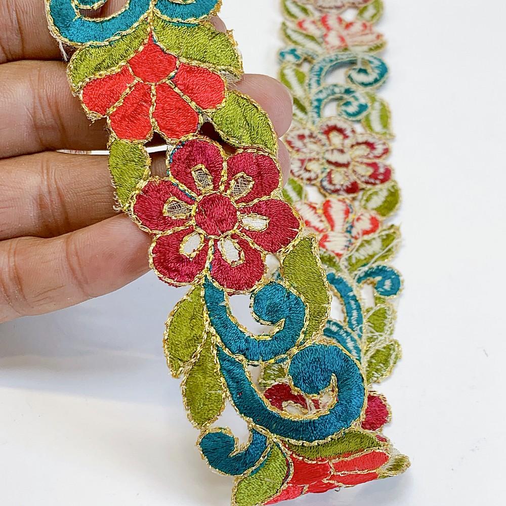 25mm Designer Cutwork Embroidery Lace, shown on white cotton