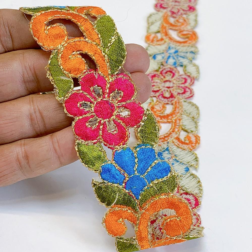 25mm Designer Cutwork Embroidery Lace, shown on white cotton