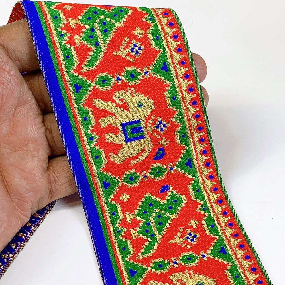 66 mm Colorful Traditional Design Cross stitch Jacquard Lace, shown on white cotton