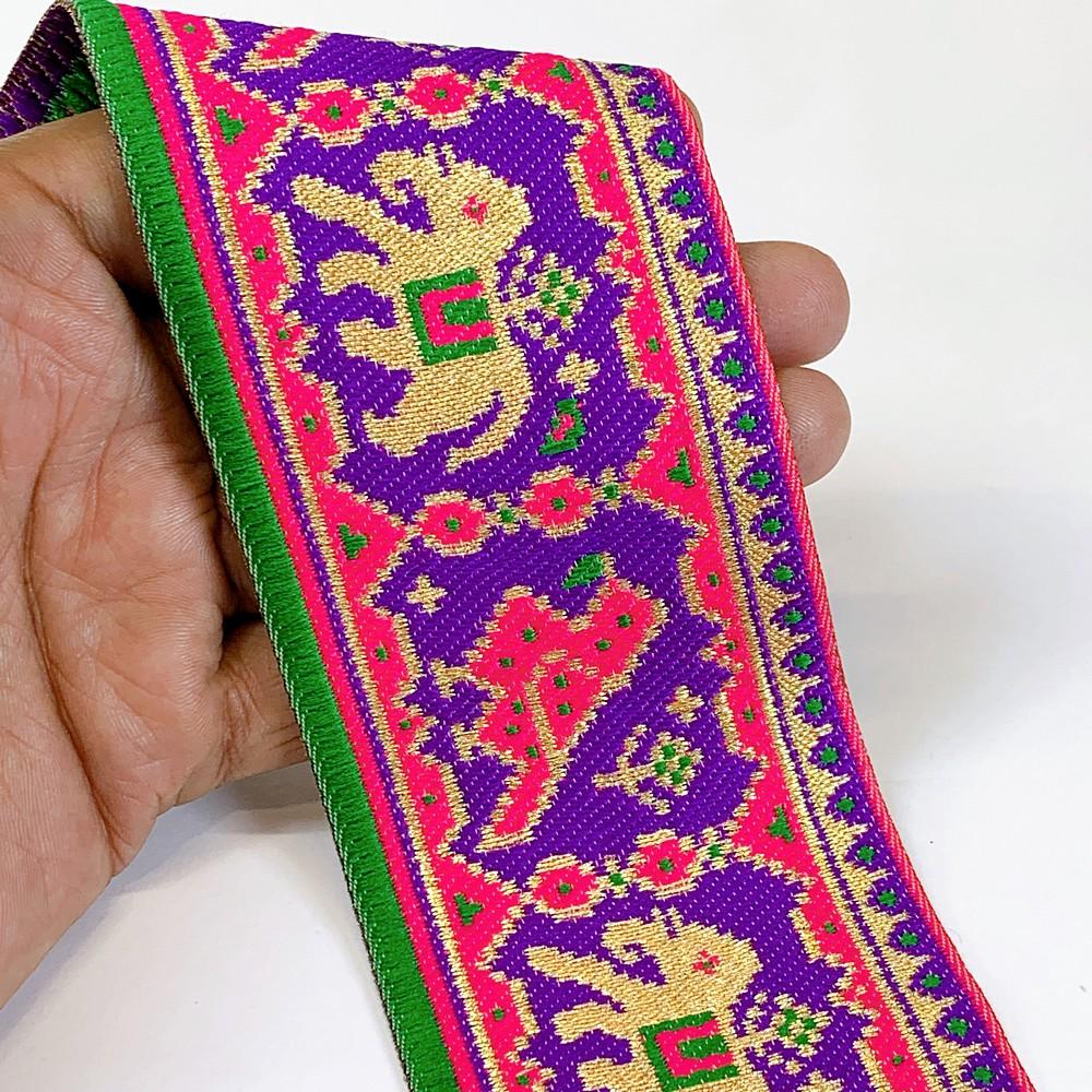 66 mm Colorful Traditional Design Cross stitch Jacquard Lace, shown on white cotton