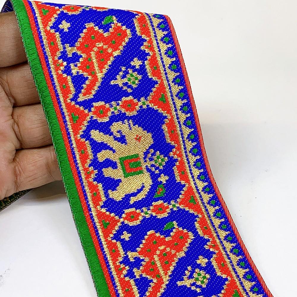 66 mm Colorful Traditional Design Cross stitch Jacquard Lace, shown on white cotton