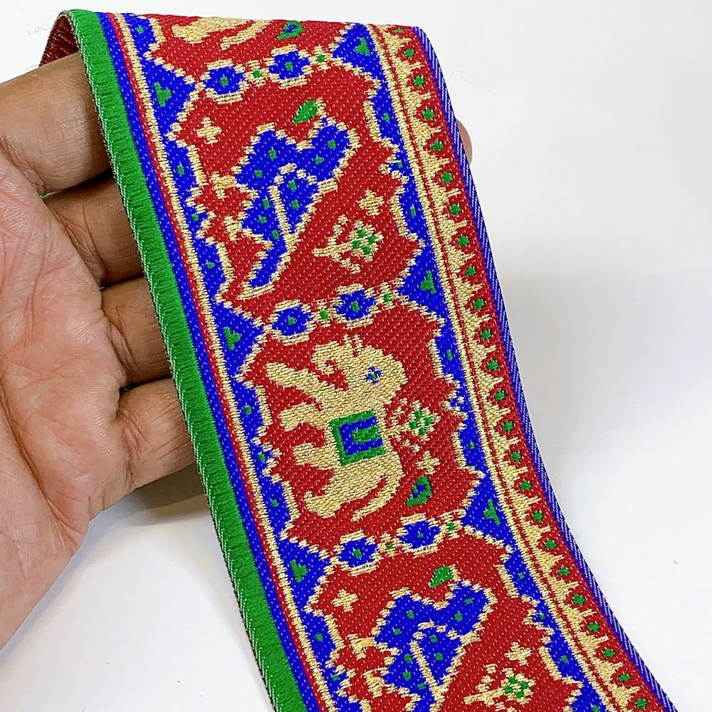 66 mm Colorful Traditional Design Cross stitch Jacquard Lace, shown on white cotton