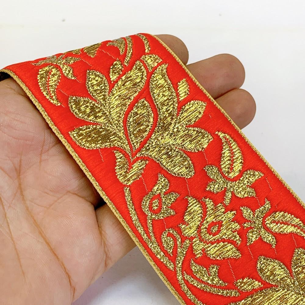 57 mm Designer Jacquard Lace With Golden Zari Thread Work, shown on white cotton