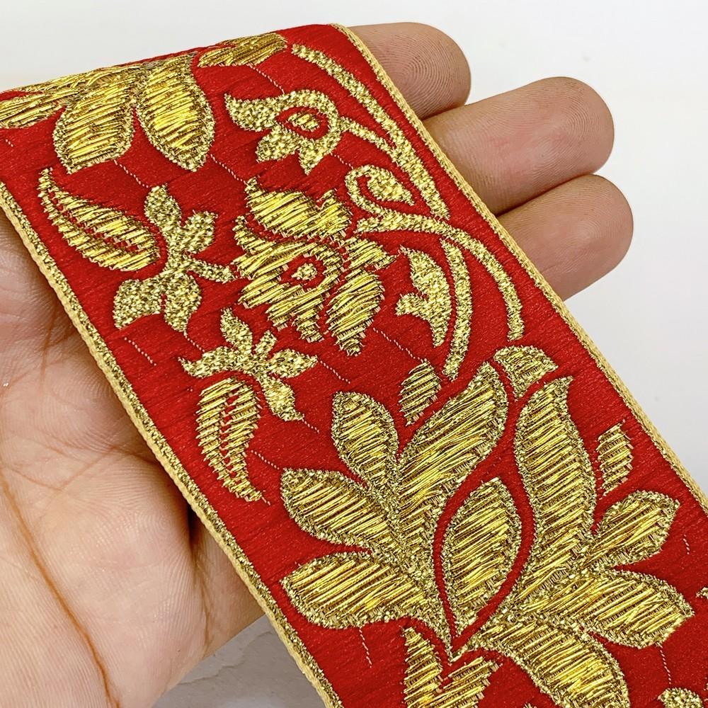 57 mm Designer Jacquard Lace With Golden Zari Thread Work, shown on white cotton