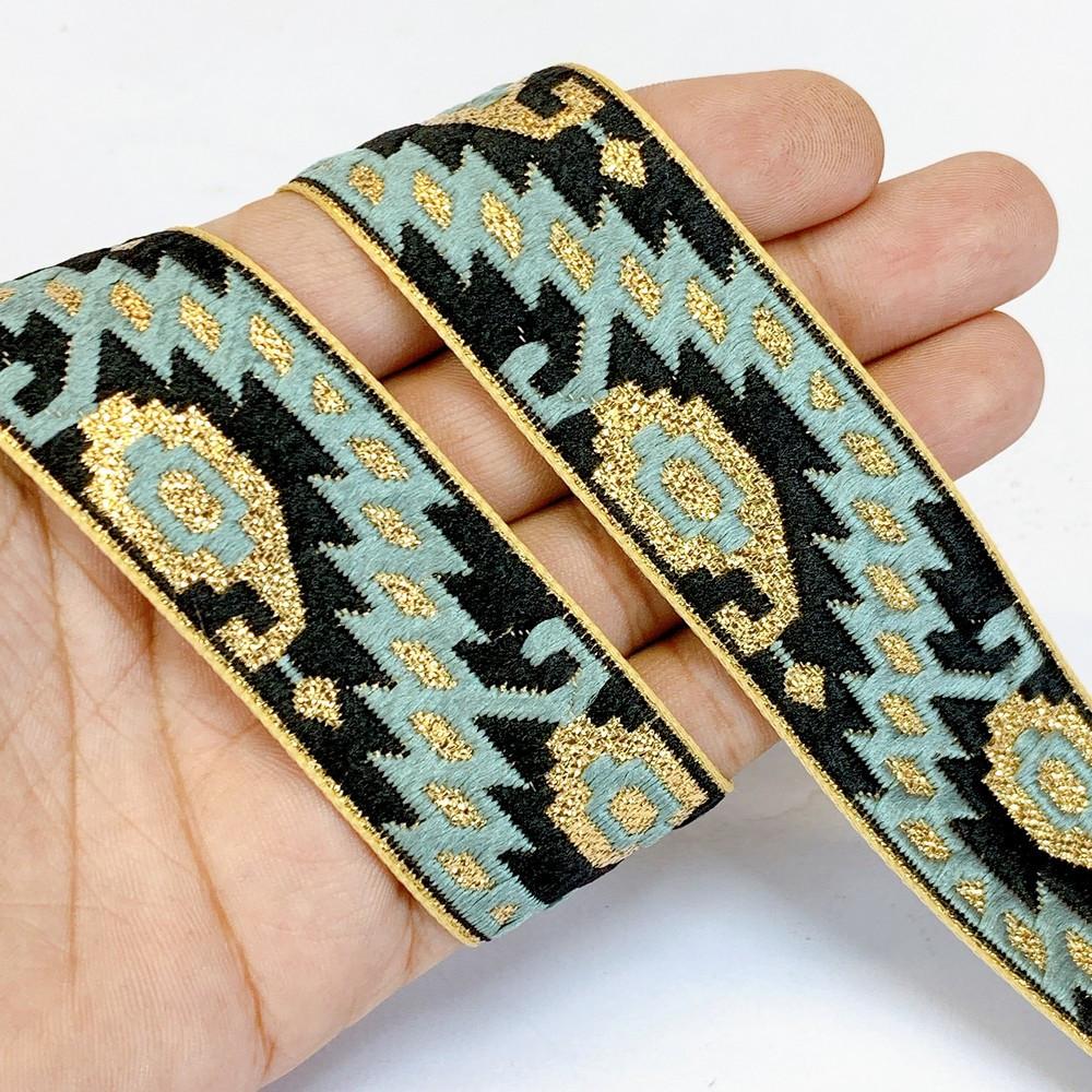 30mm Designer Jacquard Lace With Golden Zari Thread Work, shown on white cotton