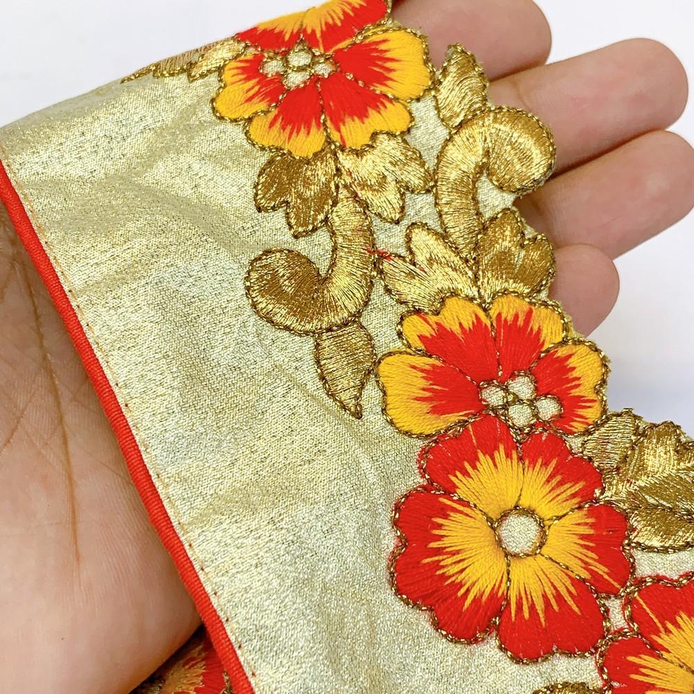 70mm Designer Cutwork Embroidery Lace, shown on white cotton