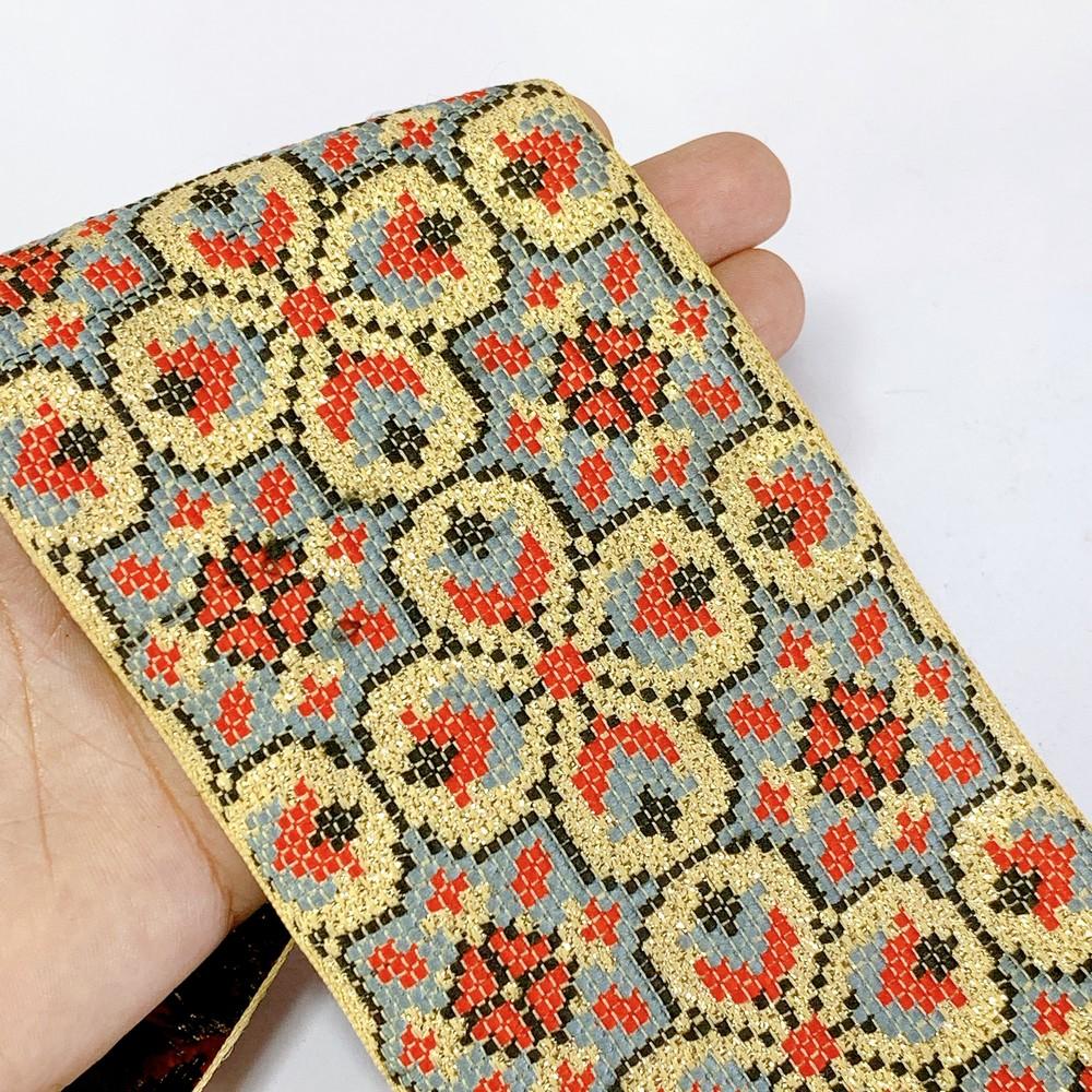 88 mm Designer Cross stitch Jacquard Ribbon, shown on white cotton