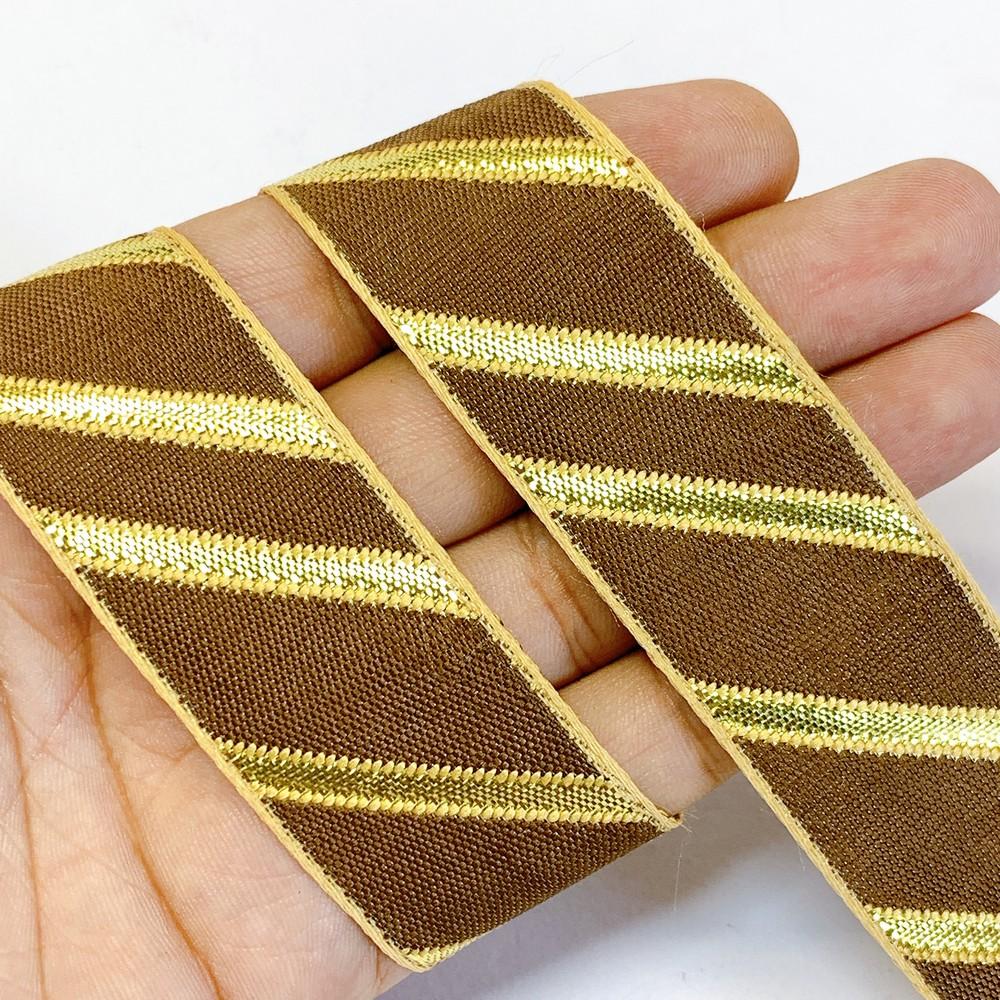 25mm Designer Jacquard Ribbon With Zari Threads, shown on white cotton