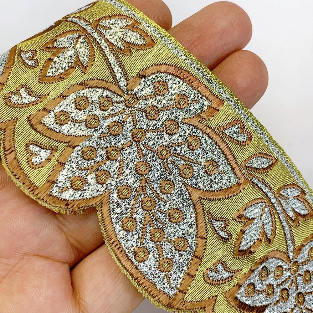 52 mm Designer Pan Cutwork Jacquard Ribbons, shown on white cotton