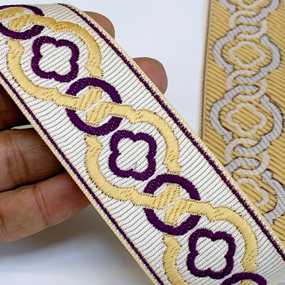 40mm Elegant Tapestry Tape with Geometric Chain Pattern, shown on white cotton