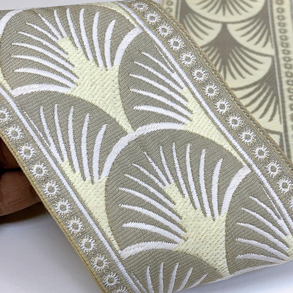 90mm Art Deco Palm Tapestry Tape, shown on white cotton