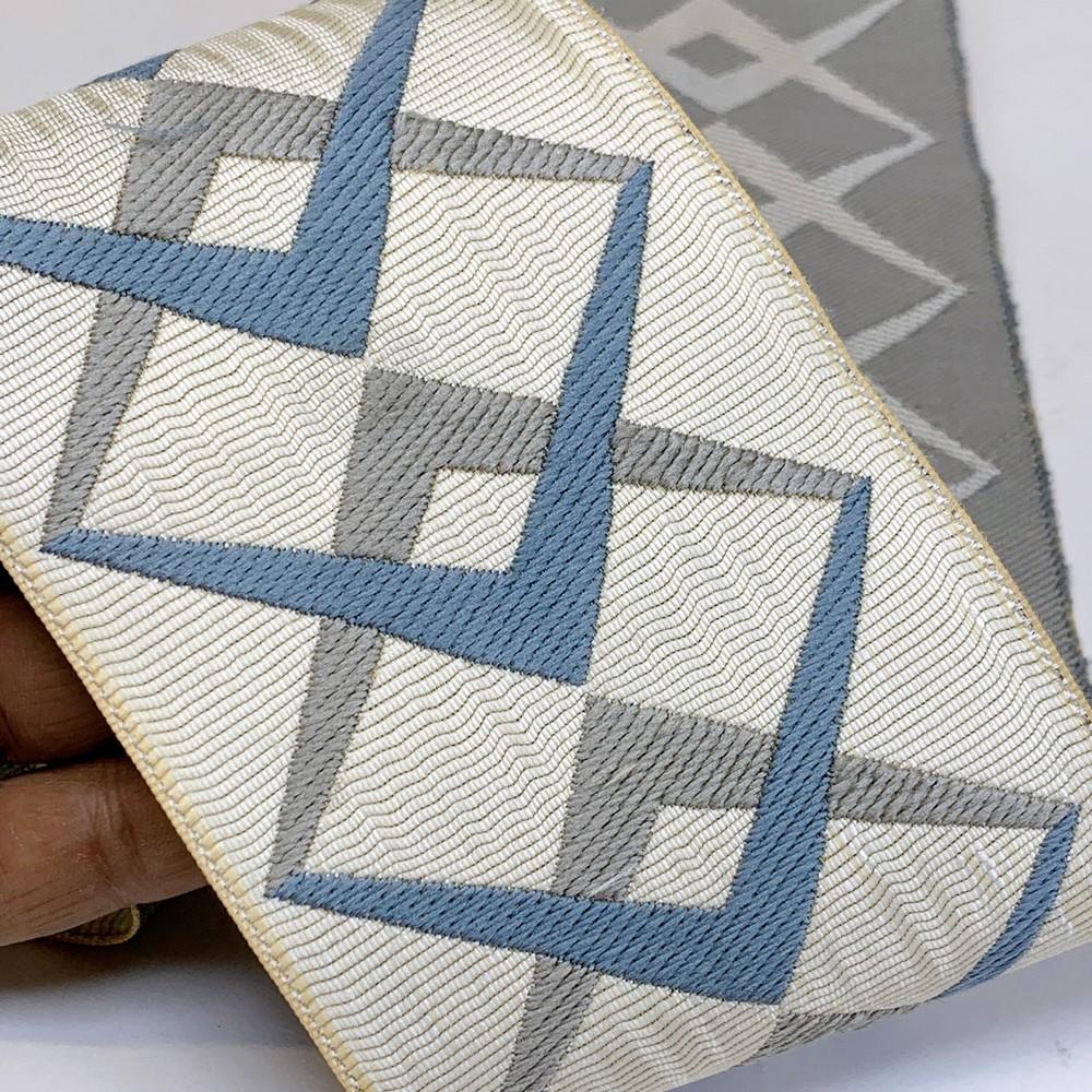 90mm Geometric Elegance Tapestry Tape, shown on white cotton