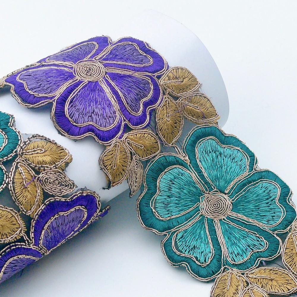 76mm Vibrant Floral Embroidered Lace, shown on white cotton
