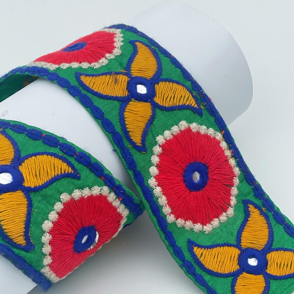 60mm Traditional Multicolor Embroidered Lace, shown on white cotton