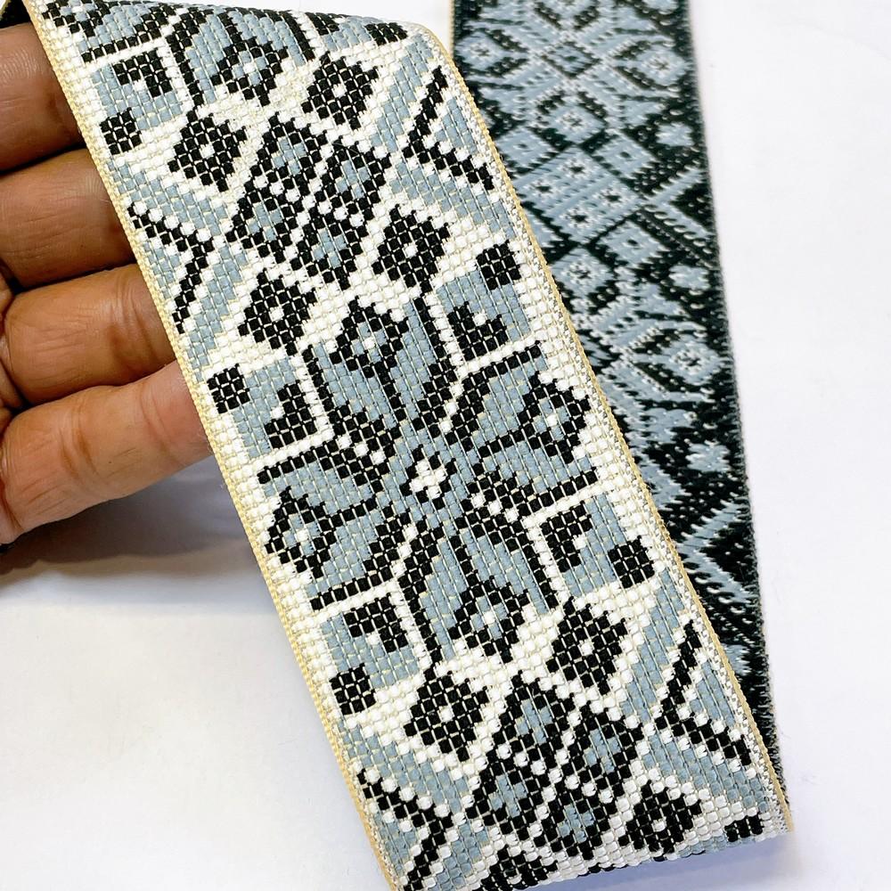 52mm Premium Cross-Stitch Jacquard Ribbon - Ethnic Geometric Border Lace for Garments & Crafts, shown on white cotton