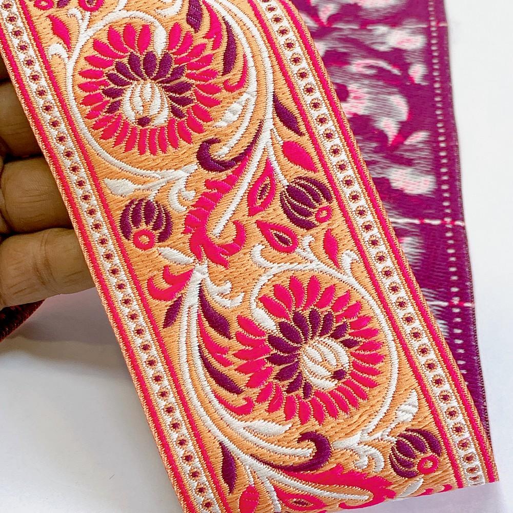74mm Woven Jacquard Lotus & Vine Ribbon | Premium Ethnic Floral Trim | Wide Multi-Color Jacquard Border for Garments, shown on white cotton