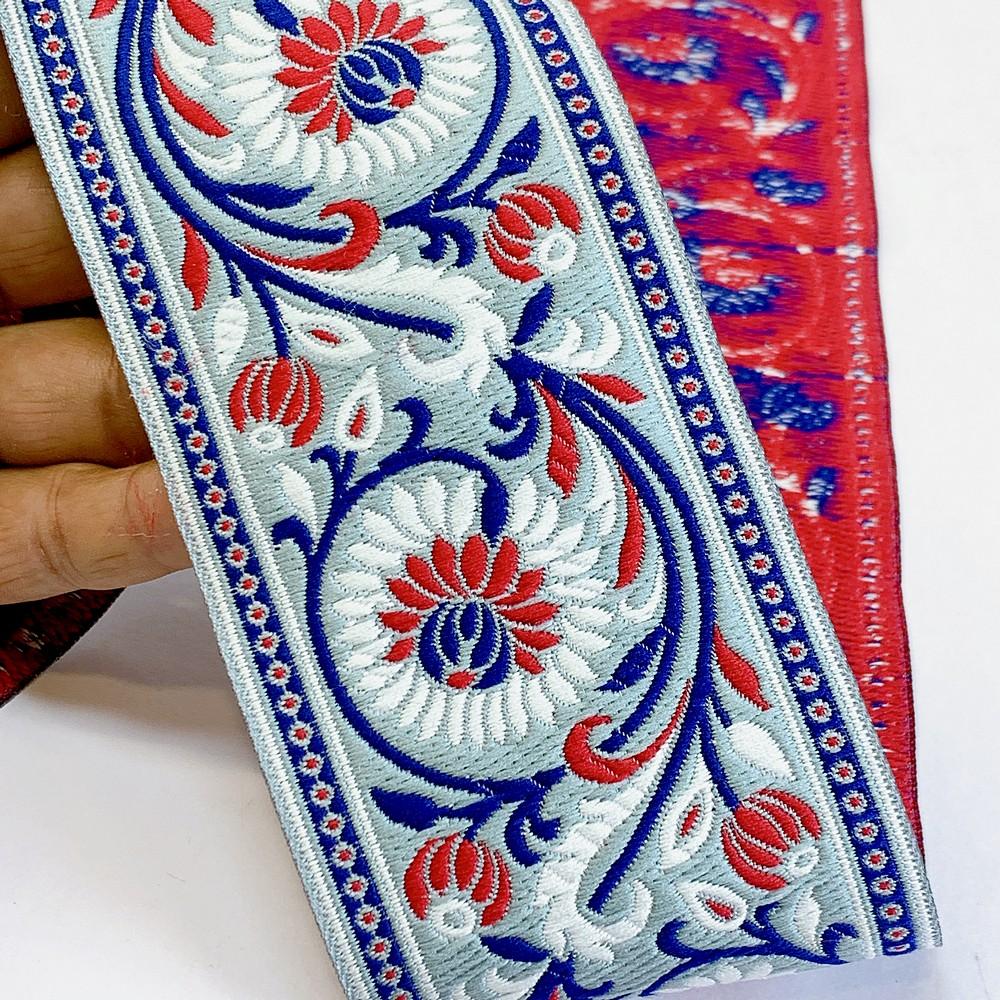 74mm Woven Jacquard Lotus & Vine Ribbon | Premium Ethnic Floral Trim | Wide Multi-Color Jacquard Border for Garments, shown on white cotton